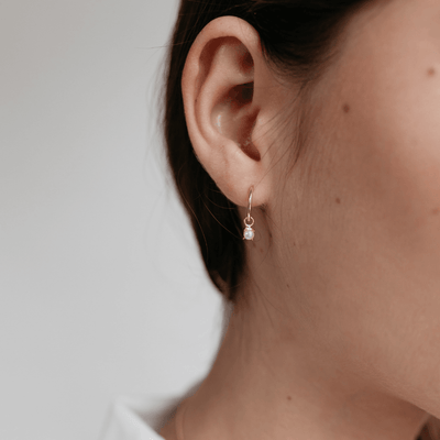 Sophie mini pearl gold earring on womans ear